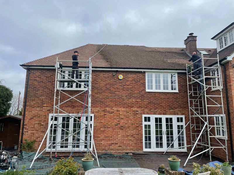 Roof cleaning carried out safely from scaffold towers by The Roof Moss Cleaners in Waterbeach